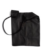Soft and lightweight leather bag with adjustable strap that mimics plastic shopping bags.
