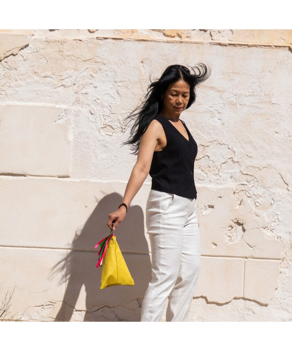 Handbag with strap.