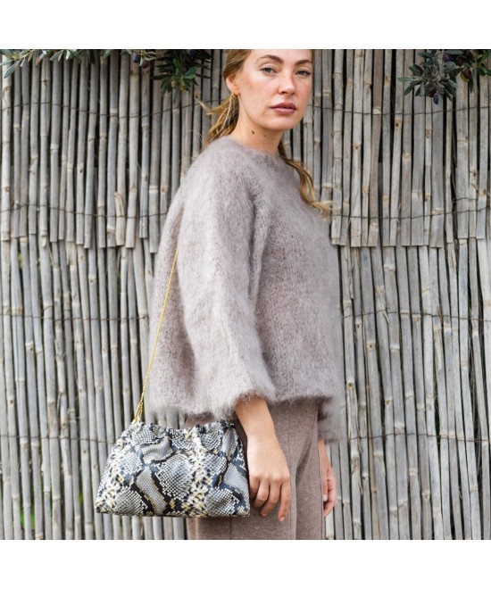 Bolso de mano de piel animal print con cadena para colgar