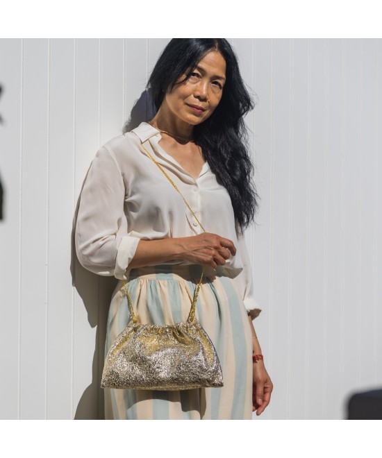 Gold leather handbag with chain for hanging