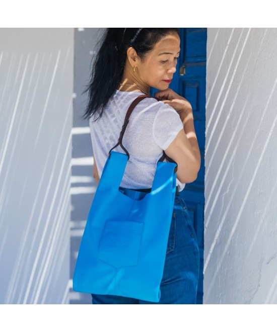 Soft and lightweight leather bag with adjustable strap that mimics plastic shopping bags.
