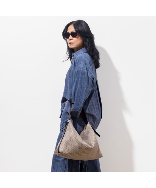 Leather backpack bag with a glossy finish.