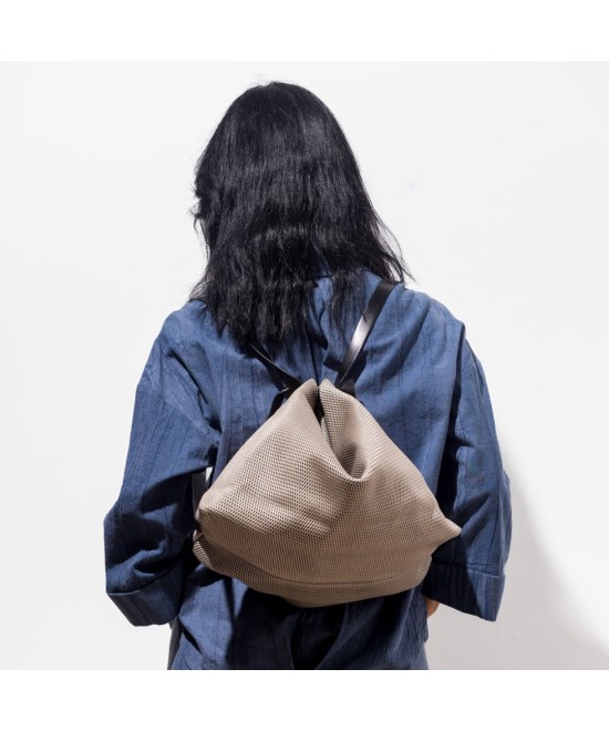 Leather backpack bag with a glossy finish.