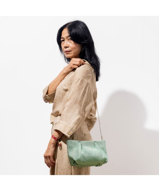 Green shiny leather handbag