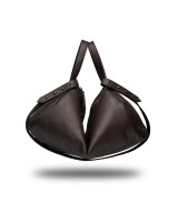 Unisex leather shoulder bag with handles and strap to cross-shoulder.