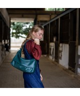 Practical and lightweight leather bag with extendable strap to carry in two positions.