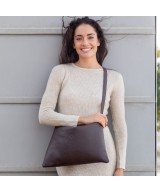 Large leather bag with adjustable strap.
