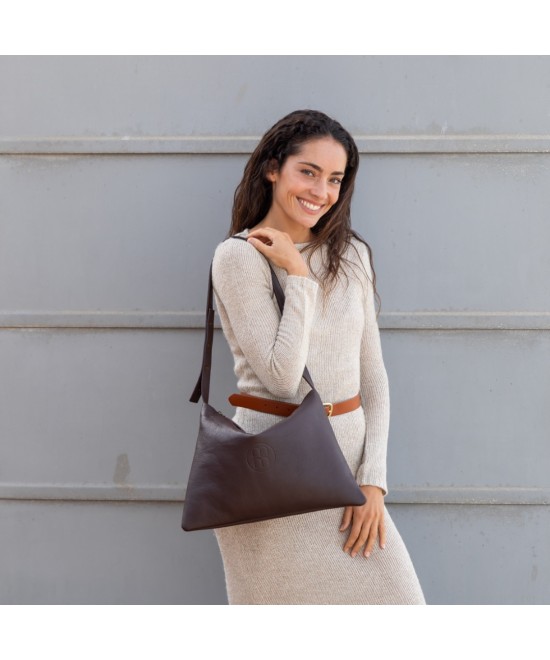 Large leather bag with adjustable strap.