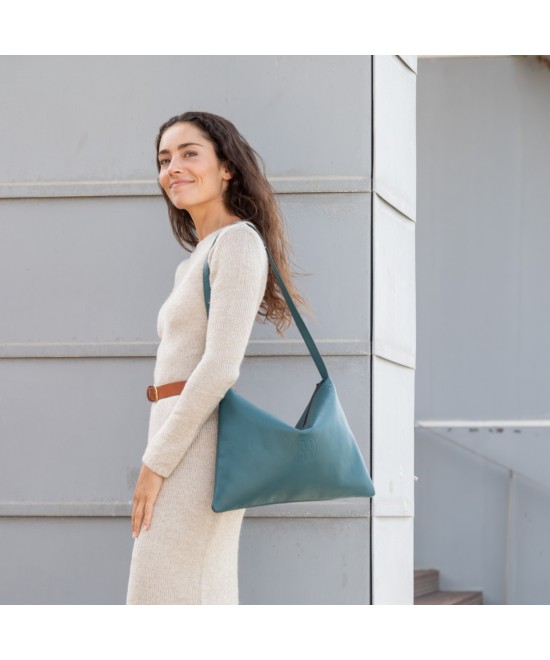 Large leather bag with adjustable strap.