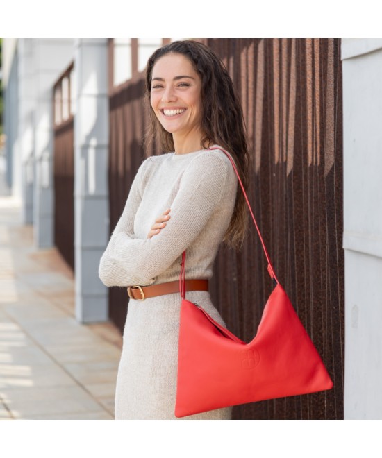 Large leather bag with adjustable strap.