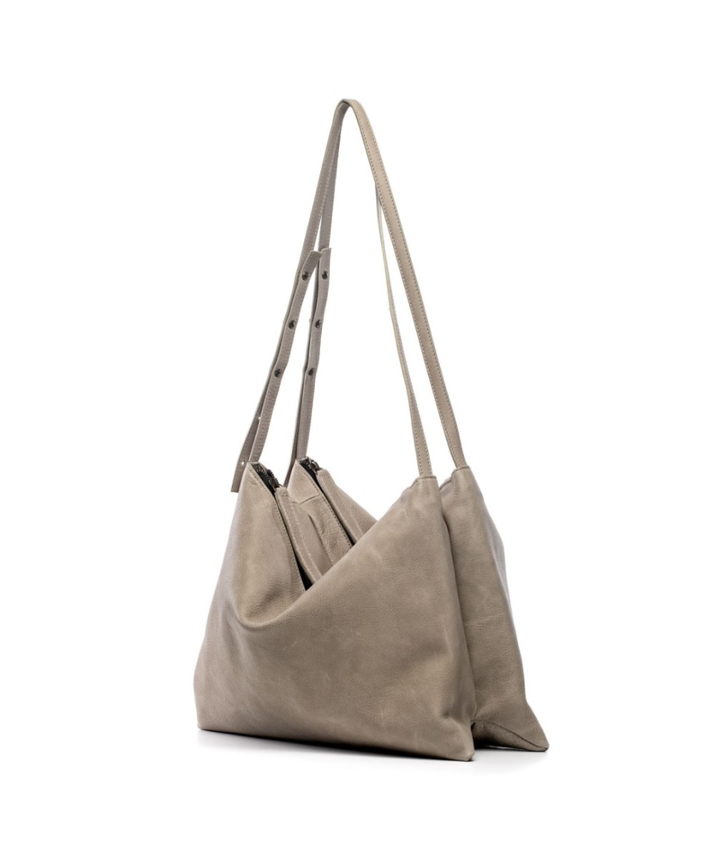 Wide leather bag with two individual departments and adjustable strap.
