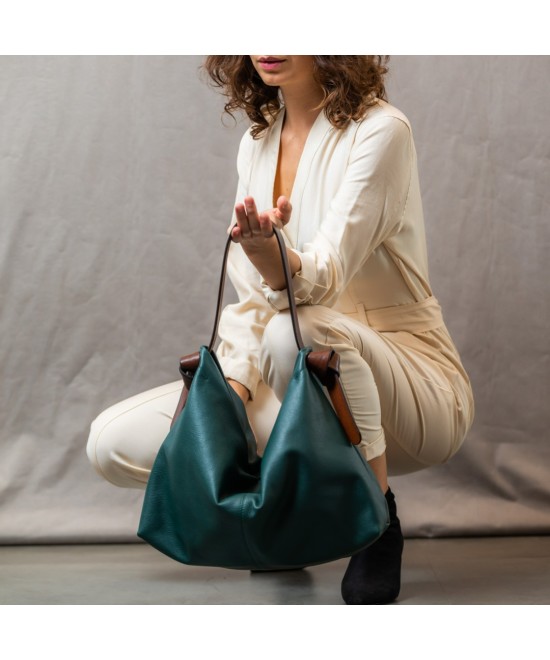 Soft and light green leather bag with a leather colored strap
