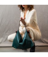 Soft and light green leather bag with a leather colored strap