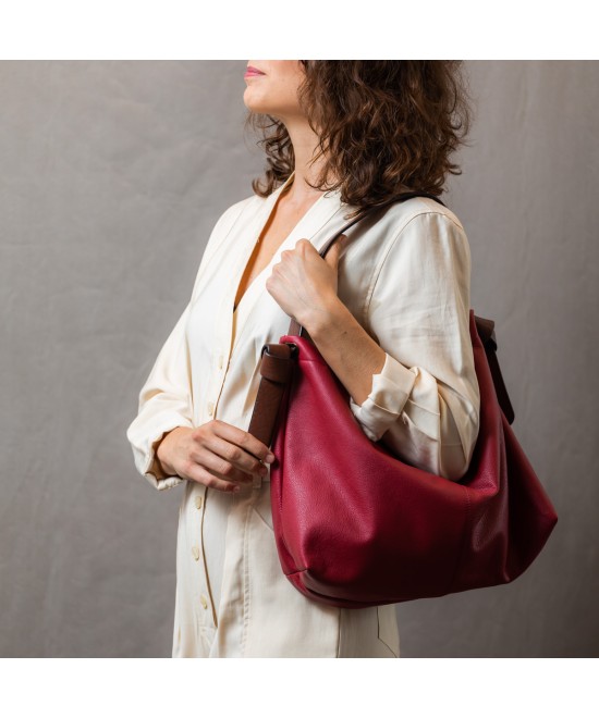 Soft and light green leather bag with a leather colored strap