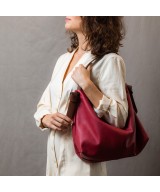 Soft and light green leather bag with a leather colored strap