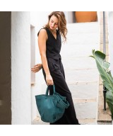 Multi-position bag with outer pockets, short handles and long adjustable strap. Green leather