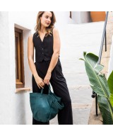 Multi-position bag with outer pockets, short handles and long adjustable strap. Green leather