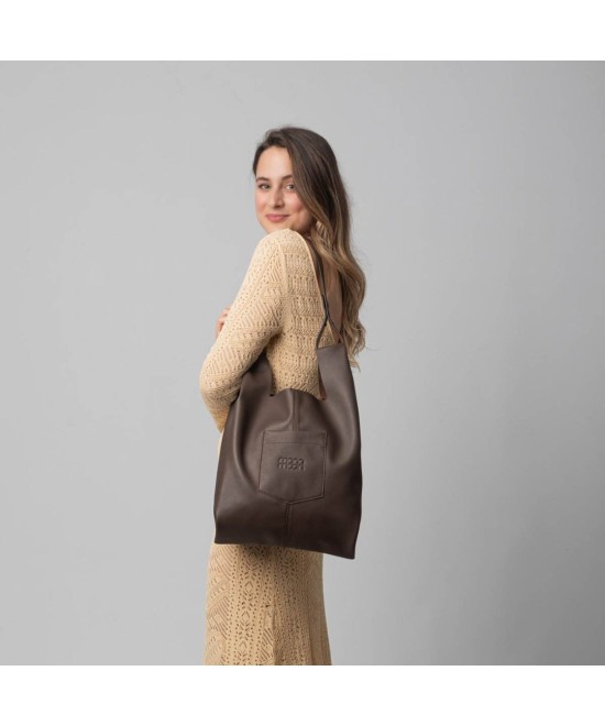 Soft and lightweight leather bag with adjustable strap that mimics plastic shopping bags.