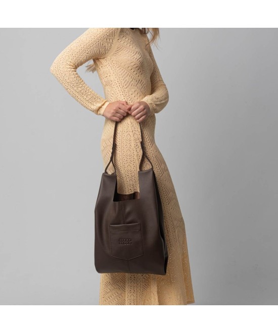 Soft and lightweight leather bag with adjustable strap that mimics plastic shopping bags.