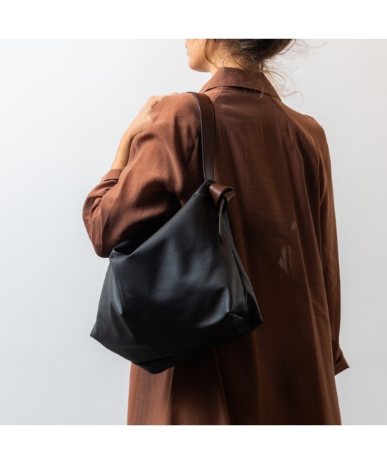 Soft and light black leather bag with a leather  strap